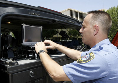 Oklahoma City Fire Capt. Jim Kruta accesses the city's Wi-Fi network from a mobile fire unit.