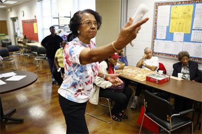 Willa Mae Graham, 81, competes in a Wii bowling game at the Langston-Brown Senior Center in Arlington, Va. The interactive video game has gained popularity among seniors, bringing them together for socializing and low-impact exercise.