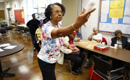 Willa Mae Graham, 81, competes in a Wii bowling game at the Langston-Brown Senior Center in Arlington, Va. The interactive video game has gained popularity among seniors, bringing them together for socializing and low-impact exercise.