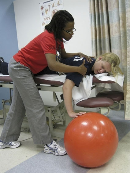 Karen Amis, a physical therapist and clinic coordinator at the National Rehabilitation Hospital in Washington, D.C., treats Eve Bulford.