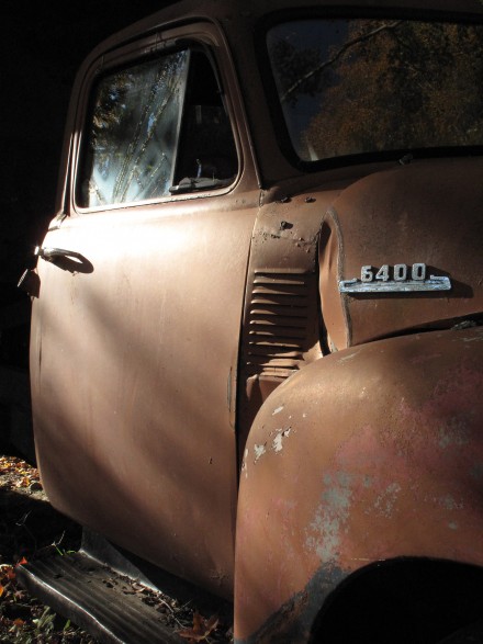 The cab of an old truck is illuminated by early morning sunlight inside an historic Vermont barn. ©Joshua Brockman 2010. All Rights Reserved.